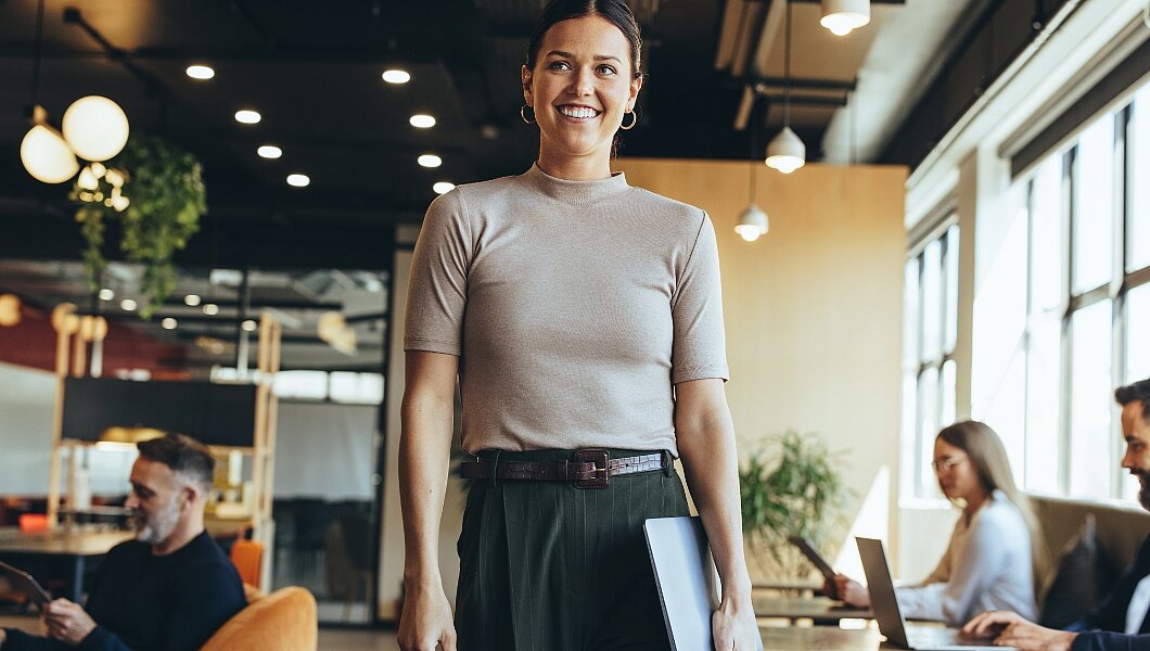 a woman standing in front of a group of people